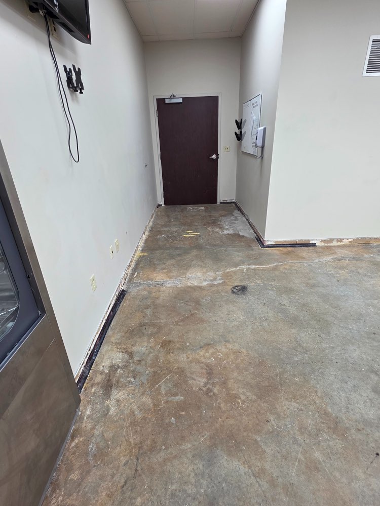 Before photo of cleanroom exit concrete before seamless floor coating