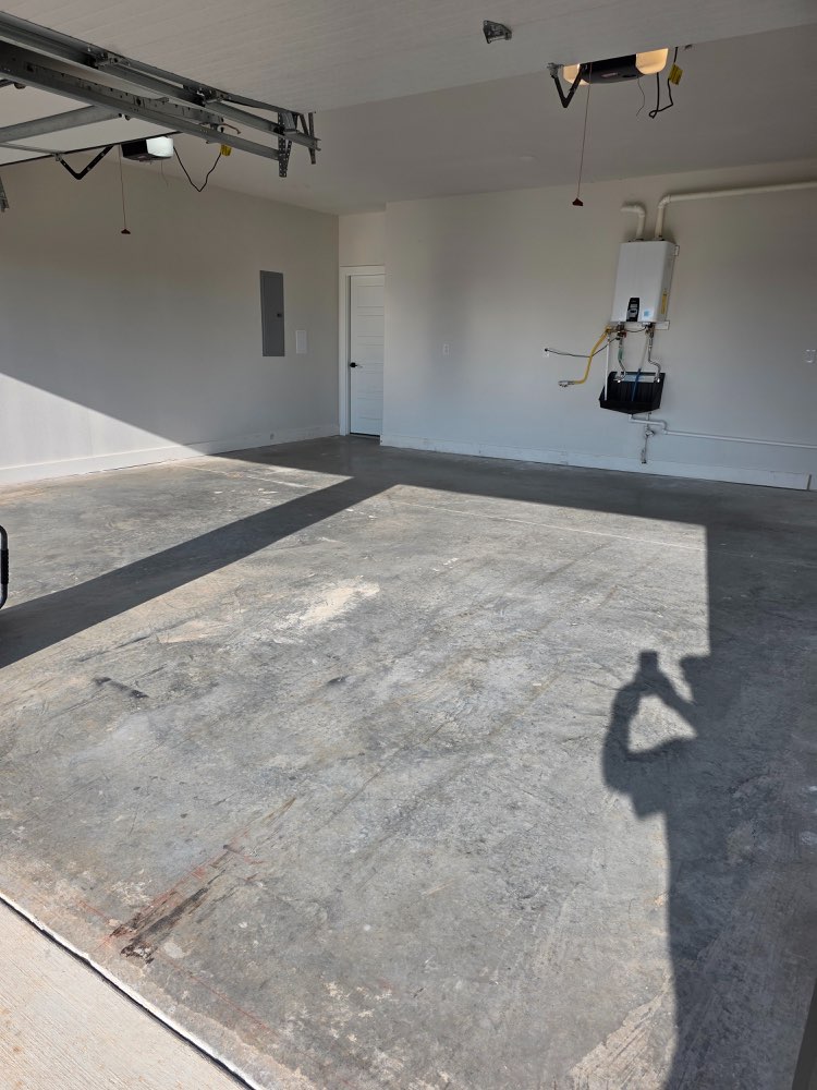 Before photo of garage and utility concrete before floor coating